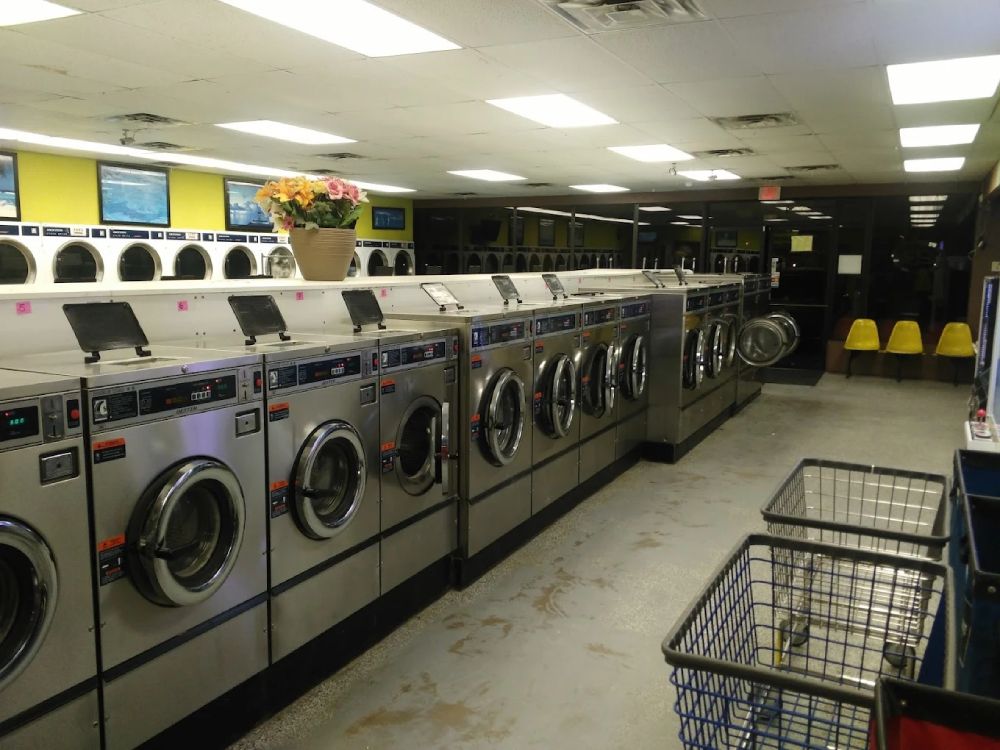 Midland TX laundromat during evening with stainless machines