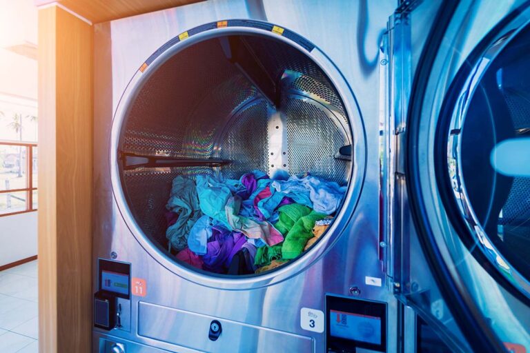 Bright clothes inside large washer at Wash Em Up Odessa